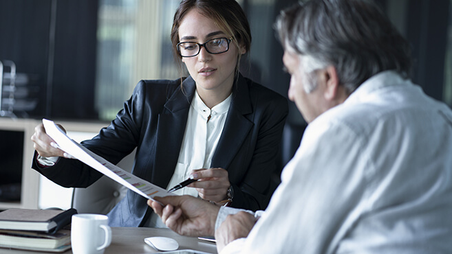 woman and man working in an office - sebra-AdobeStock