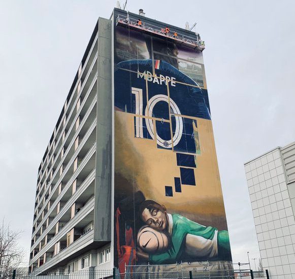 mural of child dreaming of Mbappé