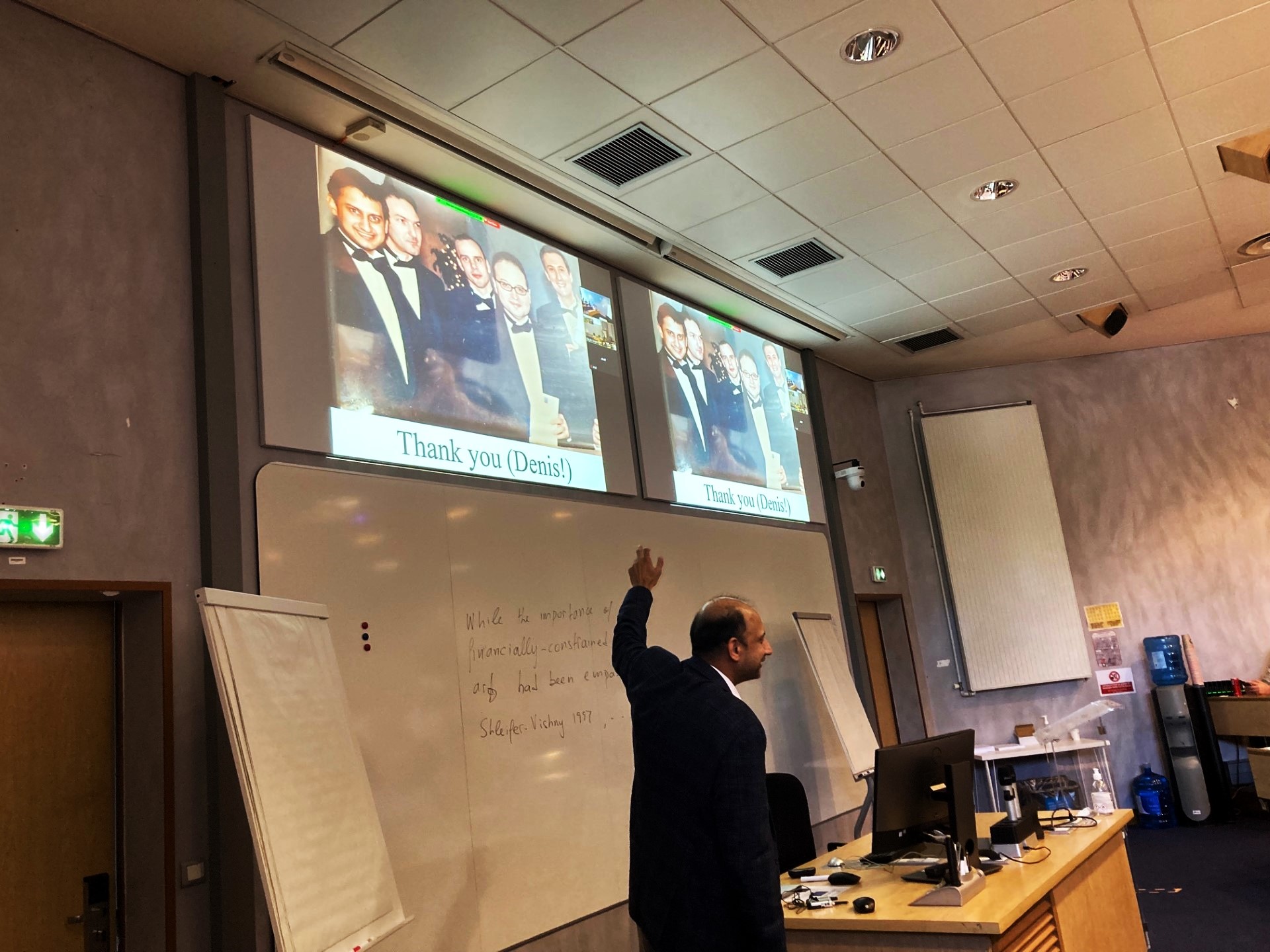 Professor Viral Acharya paying homage to a young Denis Gromb, second from left