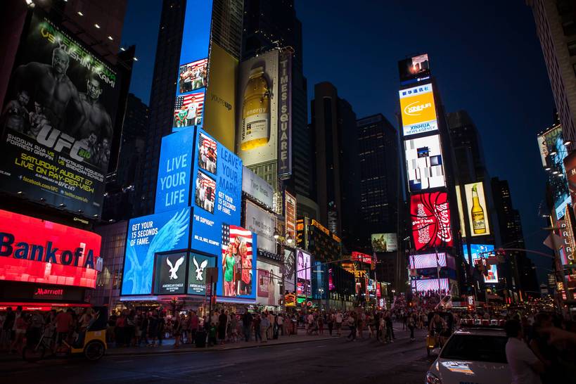 time square in New York by night, Reno Laithienne on Unsplash