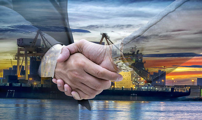 handshake in front of an oil refinery - jittawit.21-AdobeStock