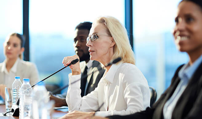 woman talking at a meeting