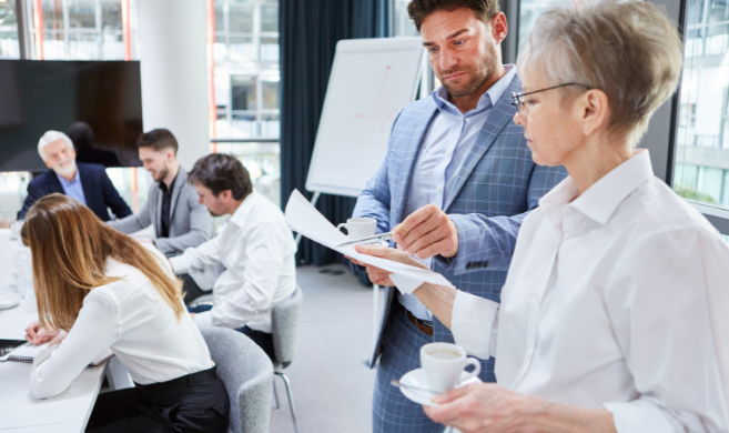 business people scrutinizing a document in a meeting room_cover