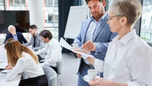 business people scrutinizing a document in a meeting room_vignette